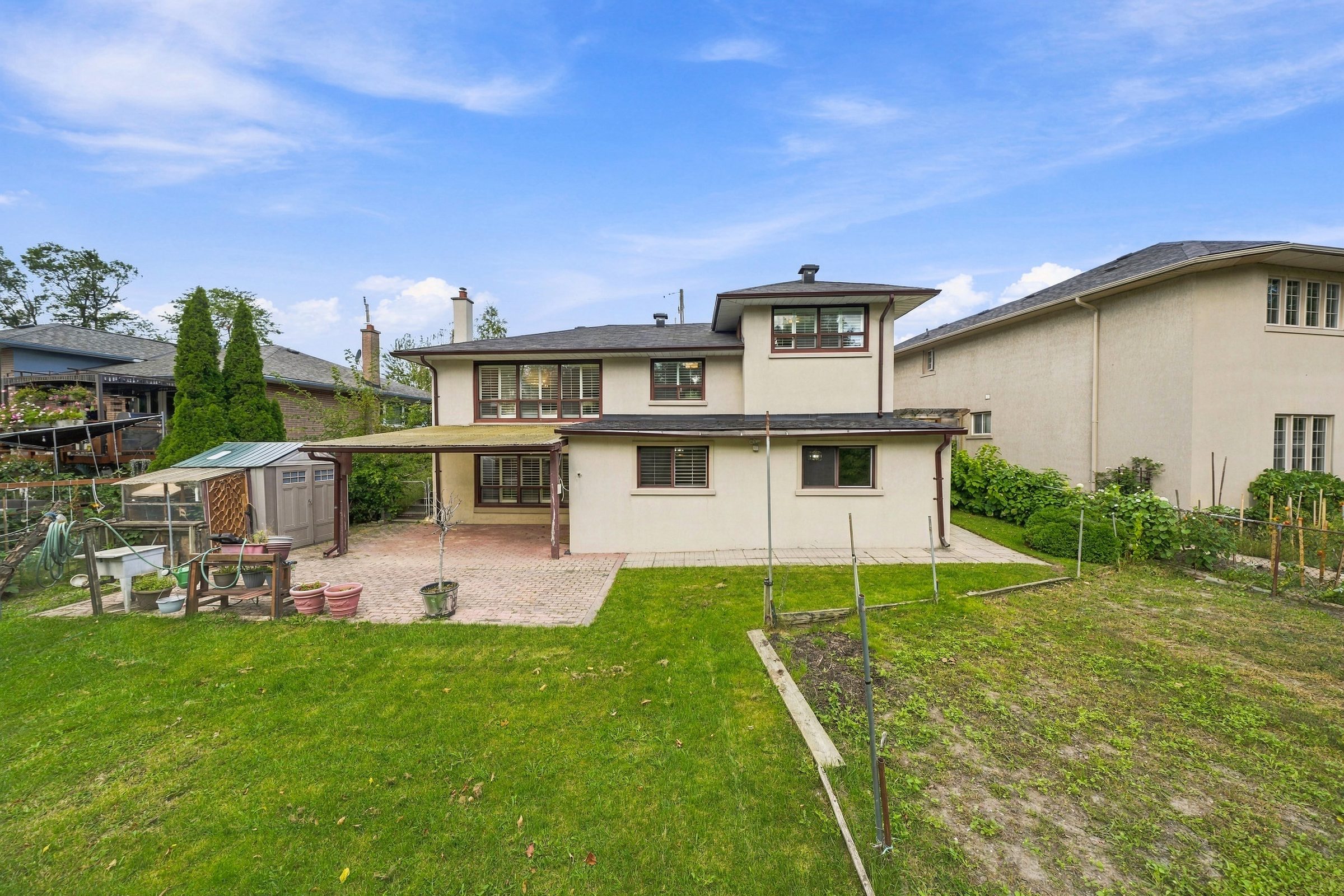 Rear elevation, patio and deep back garden
