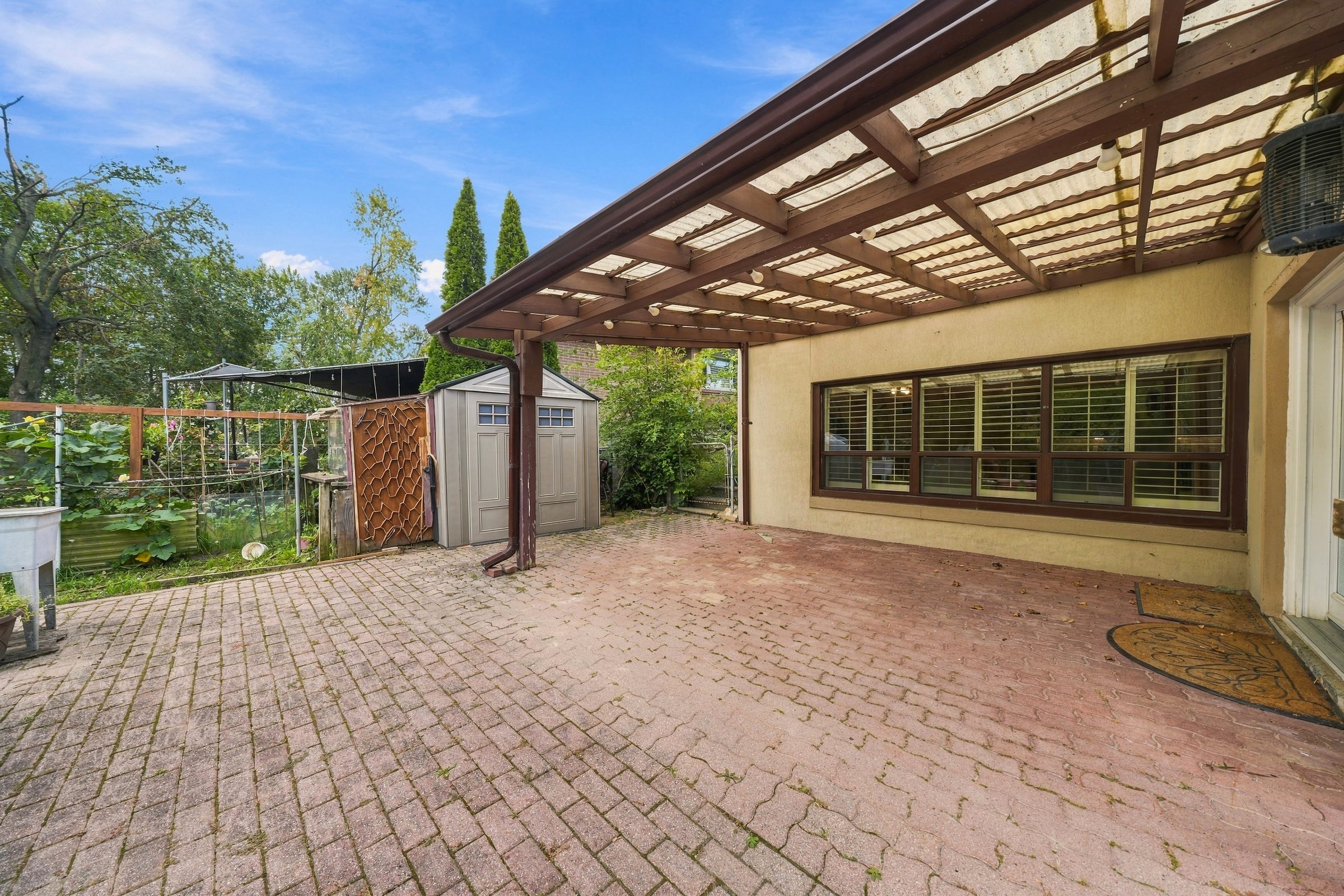 Covered patio and pergola off the rear of the house
