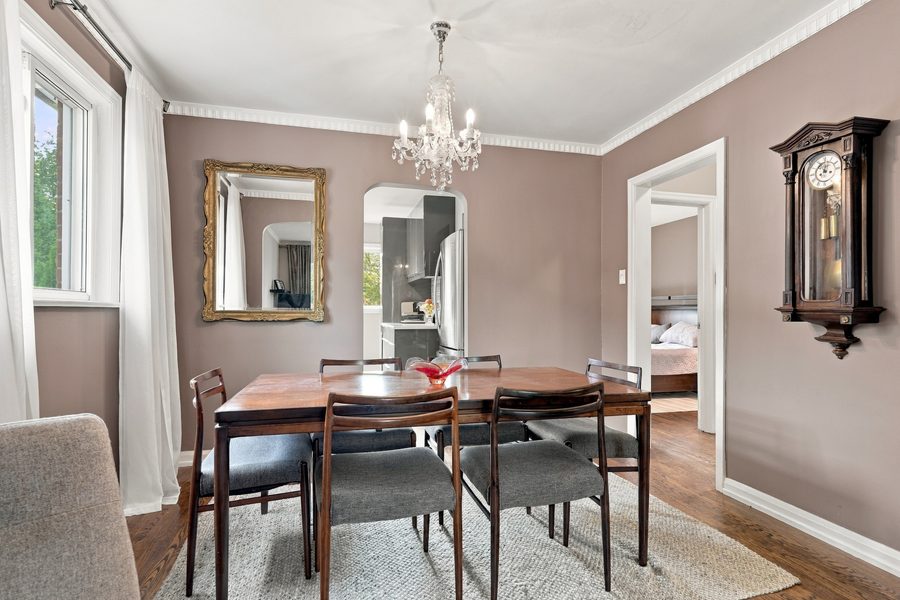 Dining room with chandelier and hardwood floors