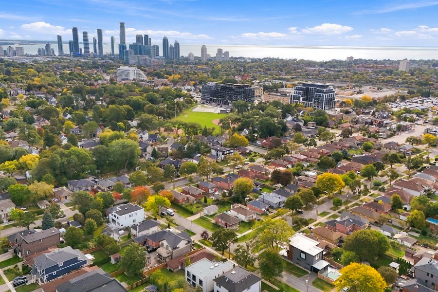 Aerial view over Norseman Heights toward the Toronto skyline